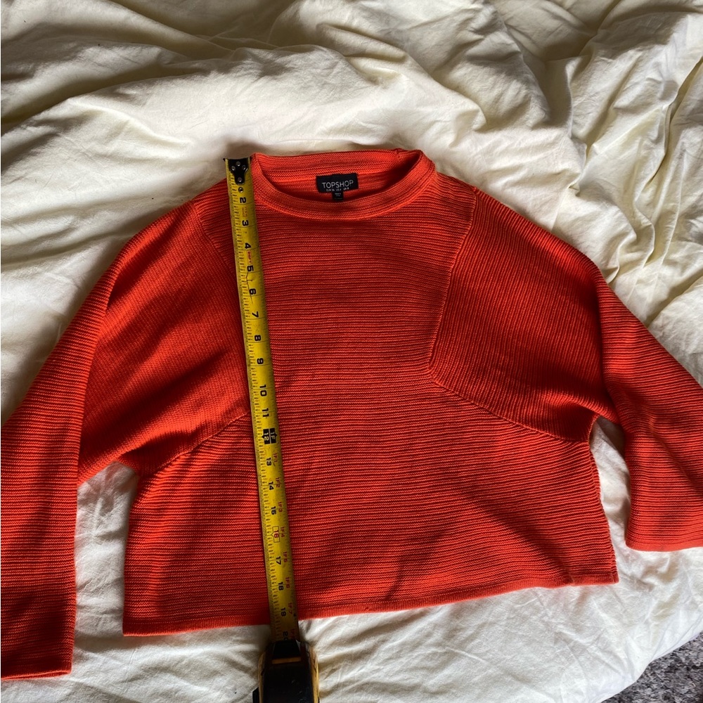 Cropped orange sweater. Topshop, size 4. Gently used.